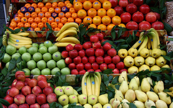 Fresh vegetables and fruit at a market stall, vibrant and inviting